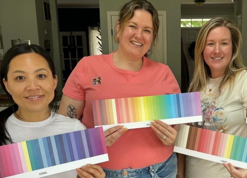 three women with their personal color palettes as part of their color analysis
